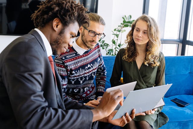 Technology consultant working with two people